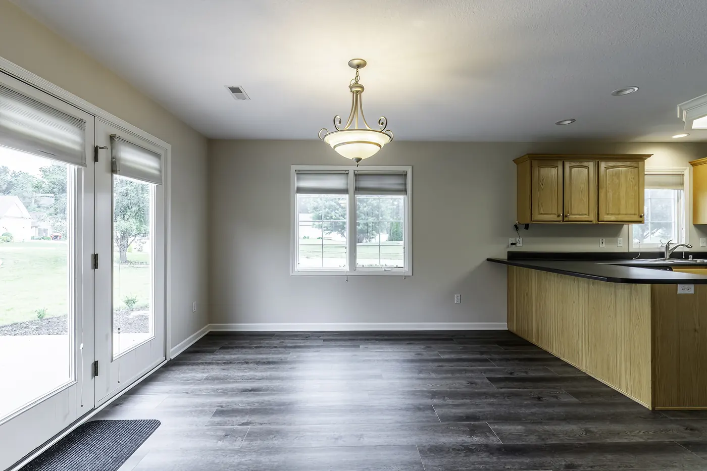 Dining area with wood-look flooring and patio access
