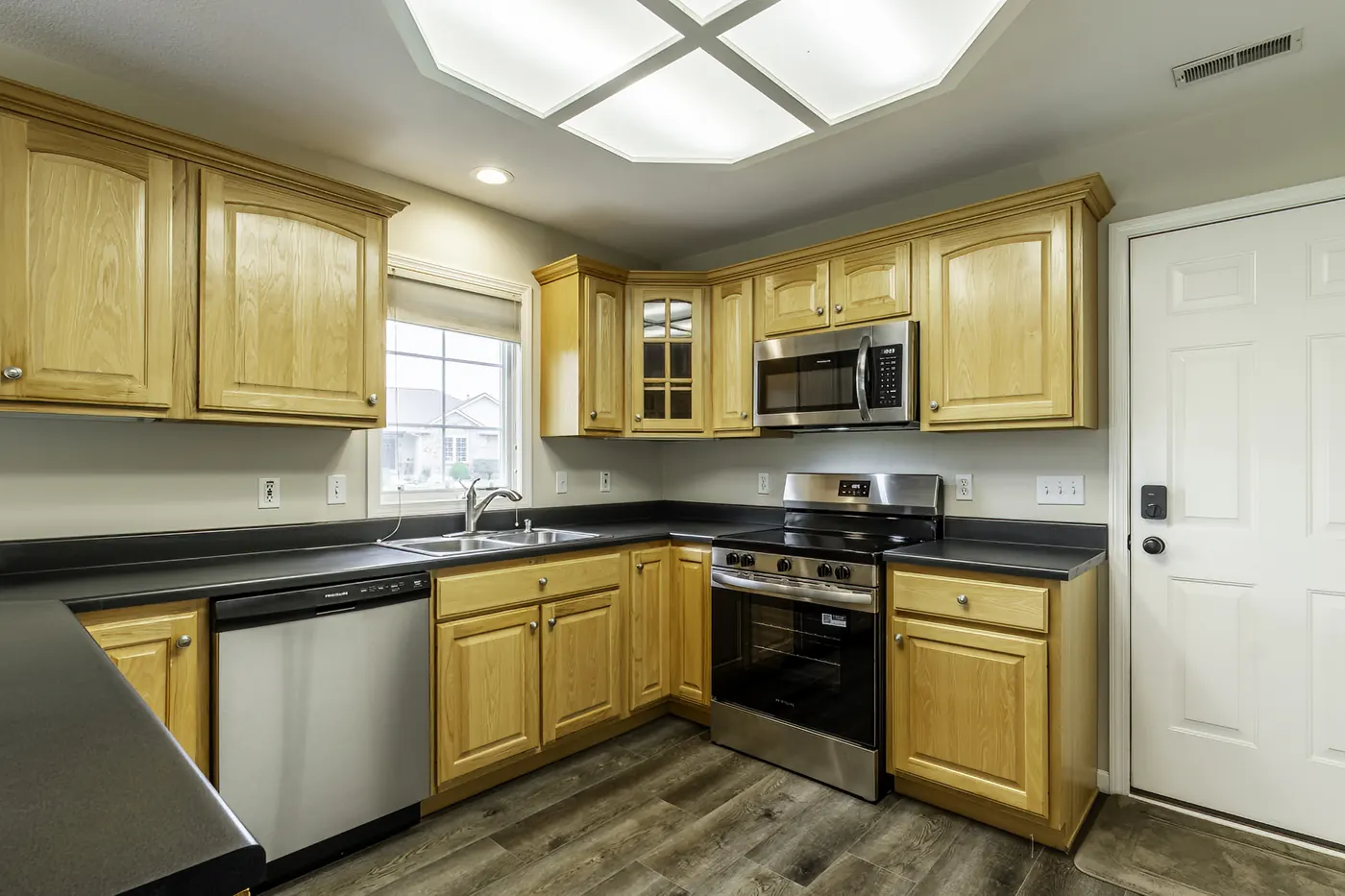 Kitchen with new stainless steel range, microwave and dishwasher at 1906 Kelleys Landing